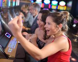 people playing slot machines